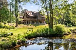 Creekfront Log Mansion with Heated Pool sleeps 28