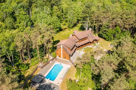 Creekfront Log Mansion with Heated Pool sleeps 28