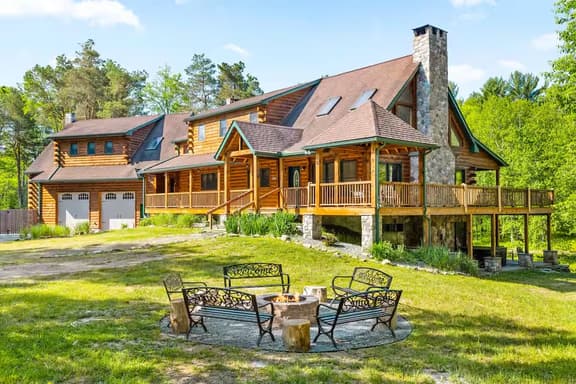 Creekfront Log Mansion with Heated Pool sleeps 28